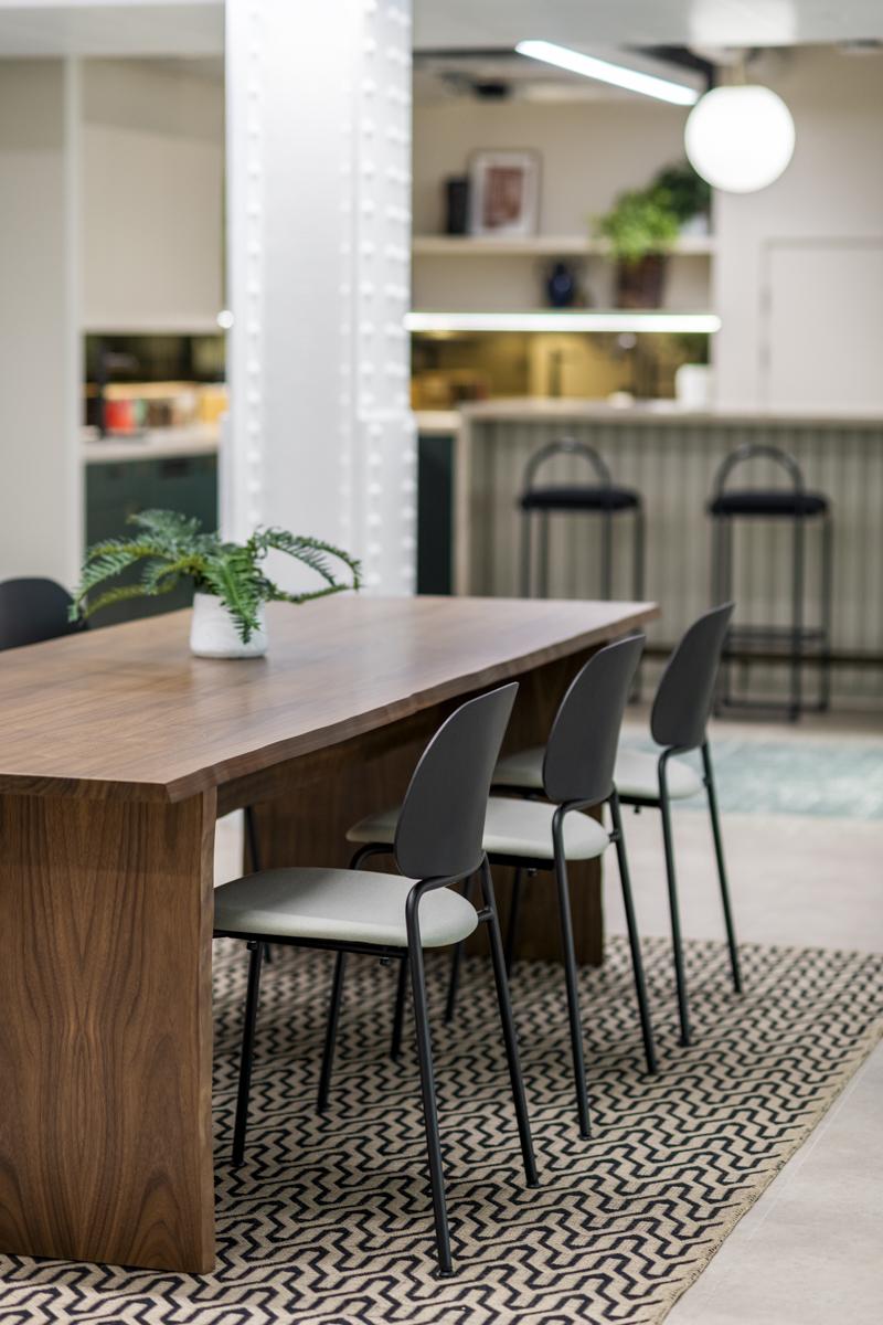 Modern meeting space with wooden table and chairs